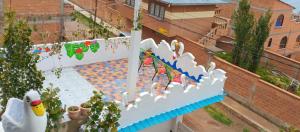 an overhead view of a swimming pool with a kite at Diamante Andino in Copacabana