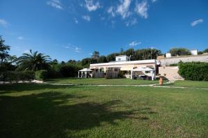 a house with a large lawn in front of it at Mammacaterina - Procida in Procida