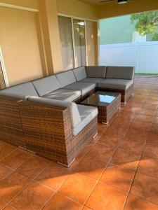 a living room with a couch and a coffee table at The Elegant Suite in Shared House in Cape Coral