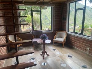 Posezení v ubytování Cabañas El Guayabillo - Baños de agua Santa