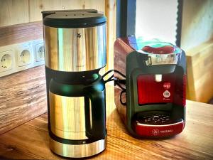 a coffee maker sitting on a table next to a blender at Chalet in Hohentauern - Chalet Ana in Hohentauern
