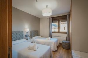 A bed or beds in a room at La Olma