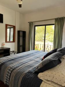 Rúm í herbergi á Posada Hacienda Real