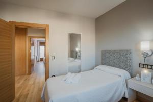 A bed or beds in a room at La Olma