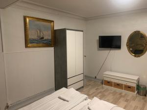 Postel nebo postele na pokoji v ubytování HotelPandekagehuset B&B
