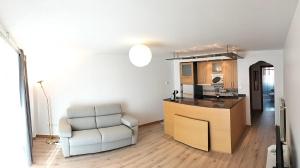 a kitchen with a counter and a chair in a room at La Jara in Fuenmayor