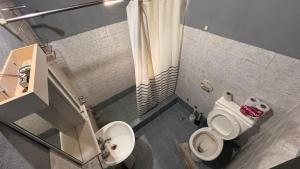 a small bathroom with a toilet and a sink at casa en costa del este para 5 personas in Costa del Este +2 photos