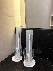two empty cups sitting on a counter next to a box at Societe by Bamboo Hospitality in Kuala Lumpur