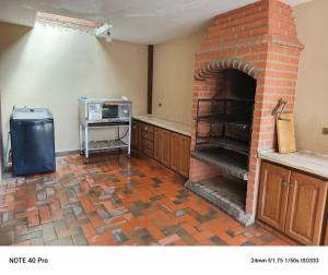 Kuchyň nebo kuchyňský kout v ubytování Hermosa casa comoda y espaciosa