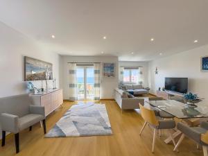 a living room with a couch and a table at Vibing & Liming Ericeira in Ericeira