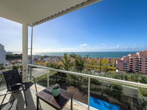 a balcony with a view of the ocean at Vibing & Liming Ericeira in Ericeira