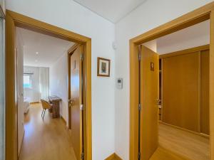 an open door to a room with a hallway at Vibing & Liming Ericeira in Ericeira