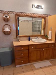 a bathroom with a sink and a mirror at 428 Boutique Guesthouse in Boscobel