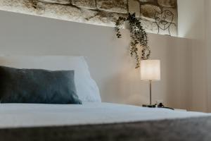 Giường trong phòng chung tại Apartamento Esencia San Vicente de la Sonsierra +14 ảnh