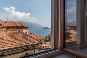 a view of the ocean from a window at Casa Rebei Menaggio in Menaggio