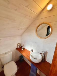 a bathroom with a sink and a toilet at Casa Grande Punta del Diablo in Punta Del Diablo