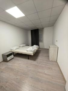 a room with a bed and a desk in it at Apartament Bellisimo in Sofia