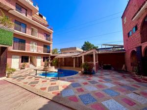a courtyard with a fountain and a building at hotel brisas del pacifico in Puerto Vallarta