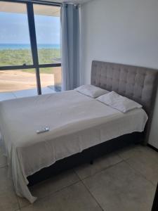 Postel nebo postele na pokoji v ubytování BARRA HOME STAY FANTASTICA Vista para o mar