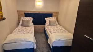 a small room with two beds in it at Apartament w Centrum in Międzybrodzie Bialskie