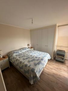 a bedroom with a bed and a window at departamentos tres habitaciones in La Serena +29 photos