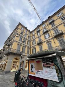 a building in front of a building with bikes parked in front at Pola's House Turin in Turin
