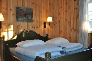 Postel nebo postele na pokoji v ubytování Løstegård Cabins