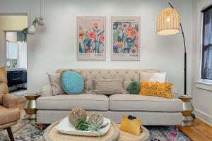 a living room with a couch and a table at Broad Ripple Getaway, Hot Tub, King Bed, Walk to Shops, Bike the Monon in Indianapolis +55 photos