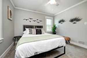 a bedroom with a bed with bats on the wall at Broad Ripple Getaway, Hot Tub, King Bed, Walk to Shops, Bike the Monon in Indianapolis