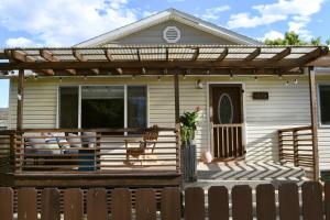 a house with a deck with a pergola at Spacious 4bed, super close to UM & Downtown, 2 living rooms in Missoula
