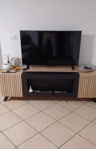 TV a/nebo společenská místnost v ubytování Casa di Minù