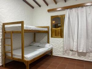Postel nebo postele na pokoji v ubytování Cabaña con piscina para disfrute social y familiar