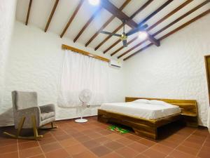 Postel nebo postele na pokoji v ubytování Cabaña con piscina para disfrute social y familiar + 12 fotografií