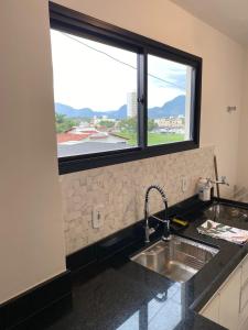 Nhà bếp/bếp nhỏ tại Res Leomarian 2 quartos Praia do Morro - Guarapari