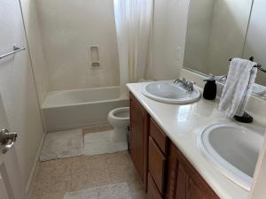a bathroom with a sink and a tub and a toilet at Have a comfortable stay! in San Jose