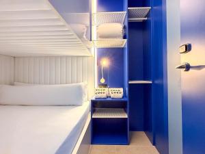 Katil atau katil-katil dalam bilik di Coeo Hernan Ruiz Rooftop Pool Hostel