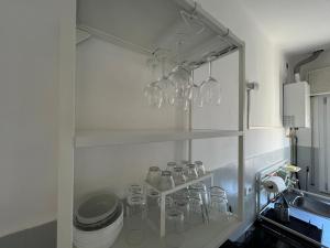 Kuchyň nebo kuchyňský kout v ubytování O&R Home Crema + 24 fotografií