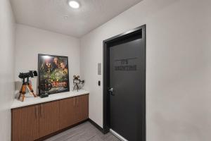 a black door with a sign on it in a room at Gorgeous 2BD 2BA Pool,Gym,Htub near Convention Ctr in Salt Lake City