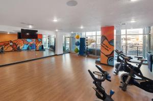 a gym with treadmills and exercise bikes in a room at Gorgeous 2BD 2BA Pool,Gym,Htub near Convention Ctr in Salt Lake City