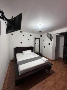 Postel nebo postele na pokoji v ubytování Hotel Yellow Maraya, Pereira