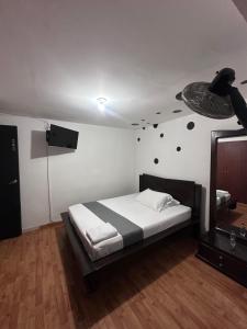 Postel nebo postele na pokoji v ubytování Hotel Yellow Maraya, Pereira