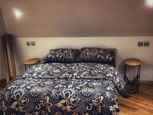 a bedroom with a bed and two tables at Grande maison moderne 5 chambres in Cherbourg en Cotentin +11 photos