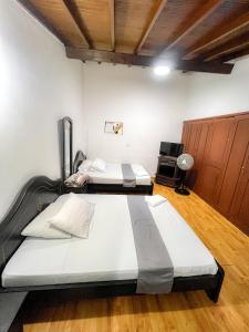 Postel nebo postele na pokoji v ubytování Hotel Yellow Maraya, Pereira