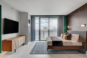 a bedroom with a large bed and a large window at 37th FLOOR STUDIO STRIP VIEW Palm Place Resort in Las Vegas +63 photos