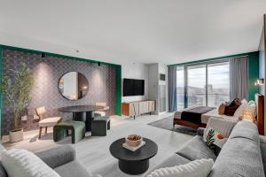 a living room with a couch and a bed at 37th FLOOR STUDIO STRIP VIEW Palm Place Resort in Las Vegas