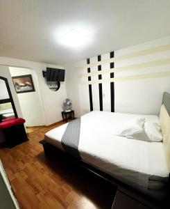 Postel nebo postele na pokoji v ubytování Hotel Yellow Maraya, Pereira