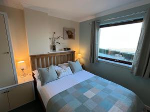 Ένα ή περισσότερα κρεβάτια σε δωμάτιο στο Balcarres Self Catering