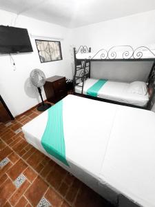 Postel nebo postele na pokoji v ubytování Hotel Yellow Maraya, Pereira