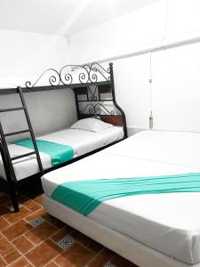 Postel nebo postele na pokoji v ubytování Hotel Yellow Maraya, Pereira