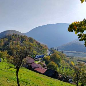 a view of a hill with houses and a mountain at Vila Čarna in Međuvršje